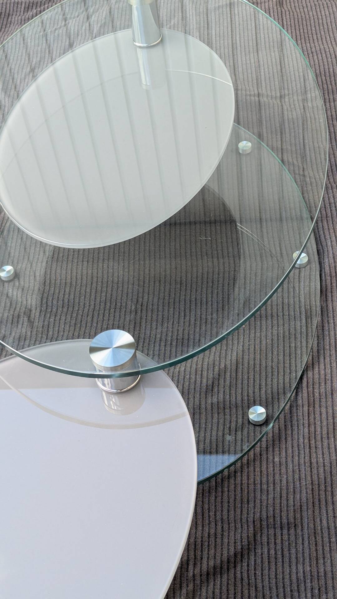 Coffee table with rotating glass tops by Antoine Motard.