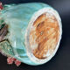 Large turquoise ceramic vase Athezza with raised floral decoration.