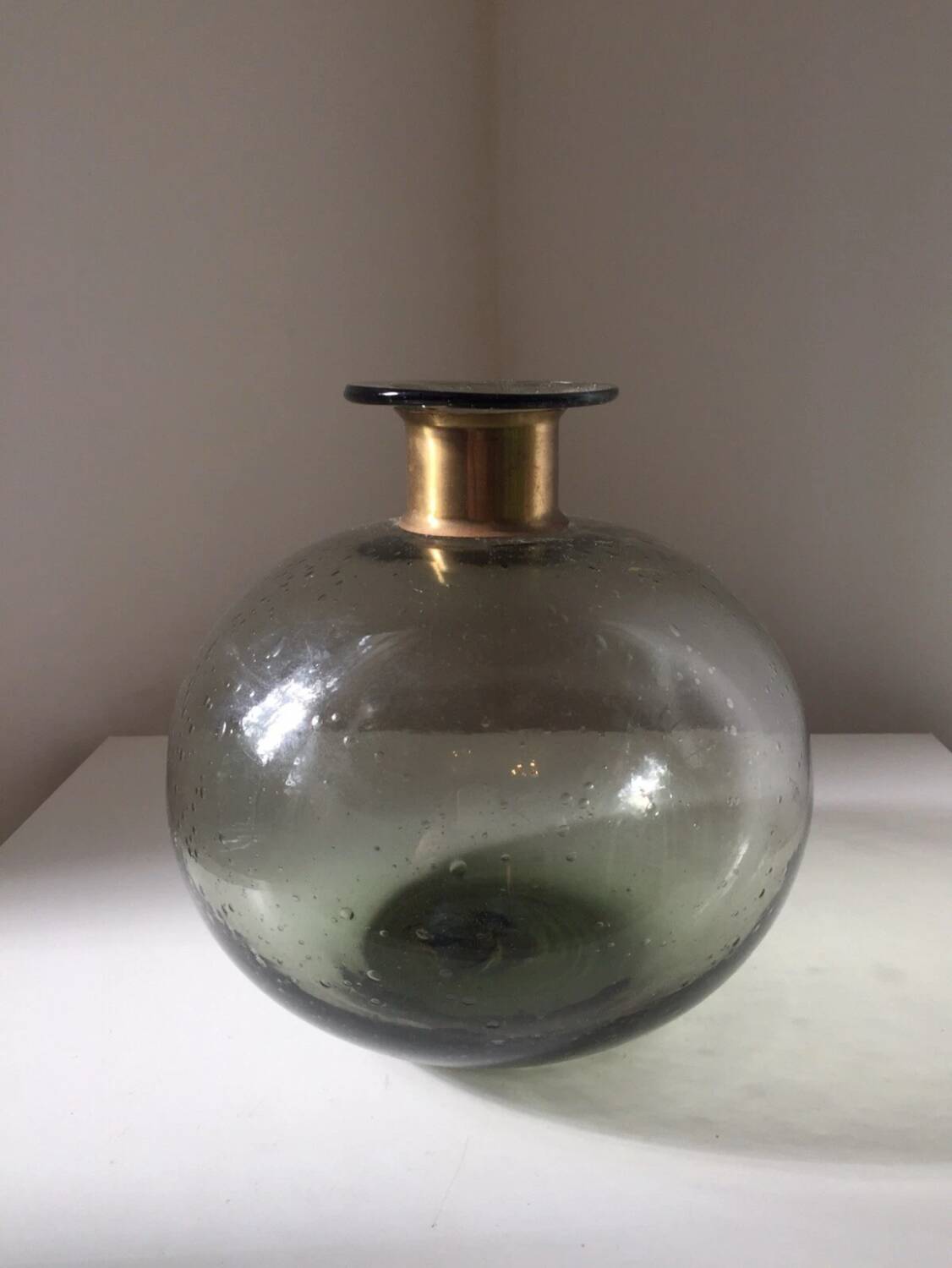 Vintage bubble glass ball vase with brass rim