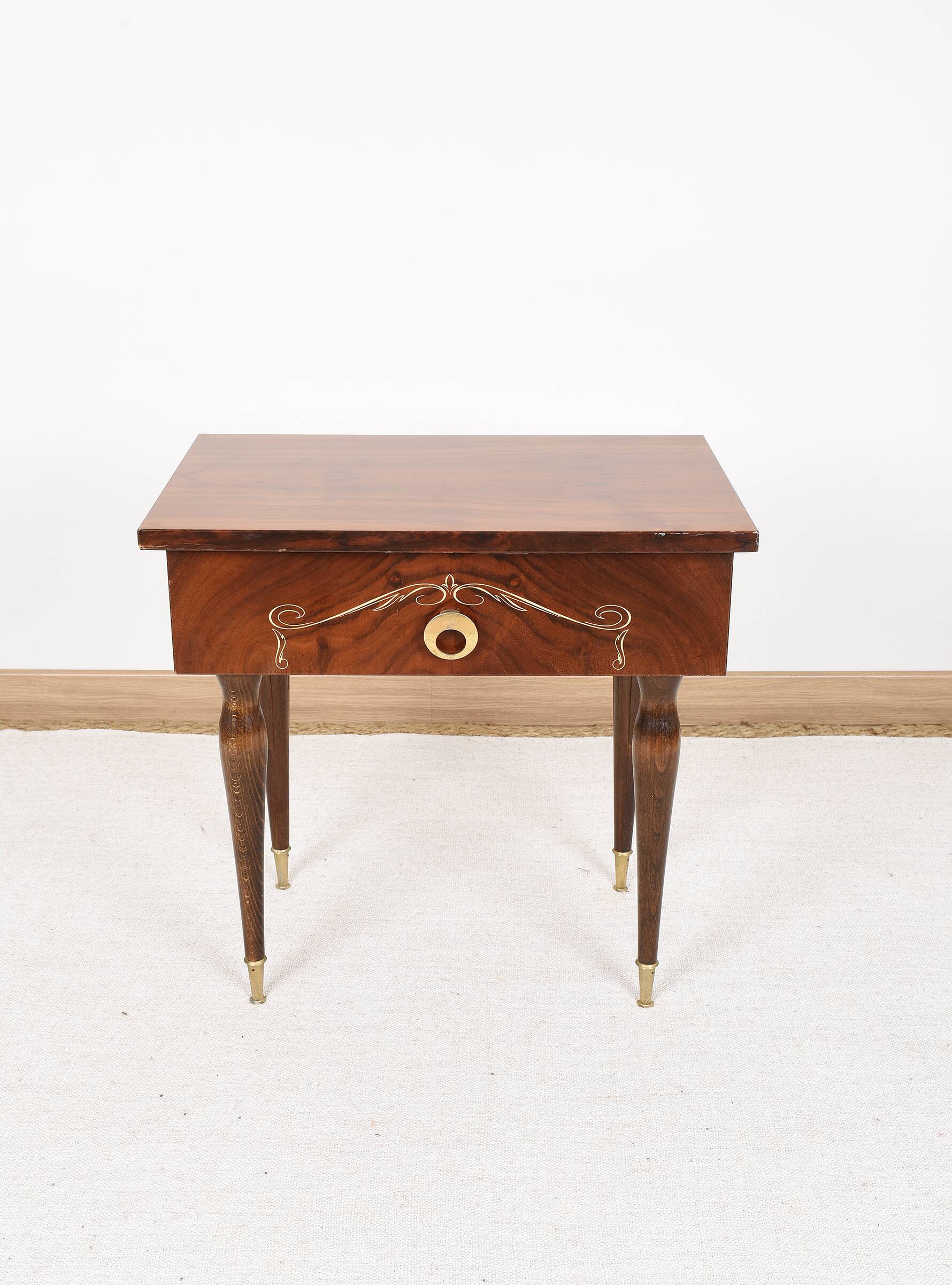 Vintage bedside table from the 70s in varnished wood.