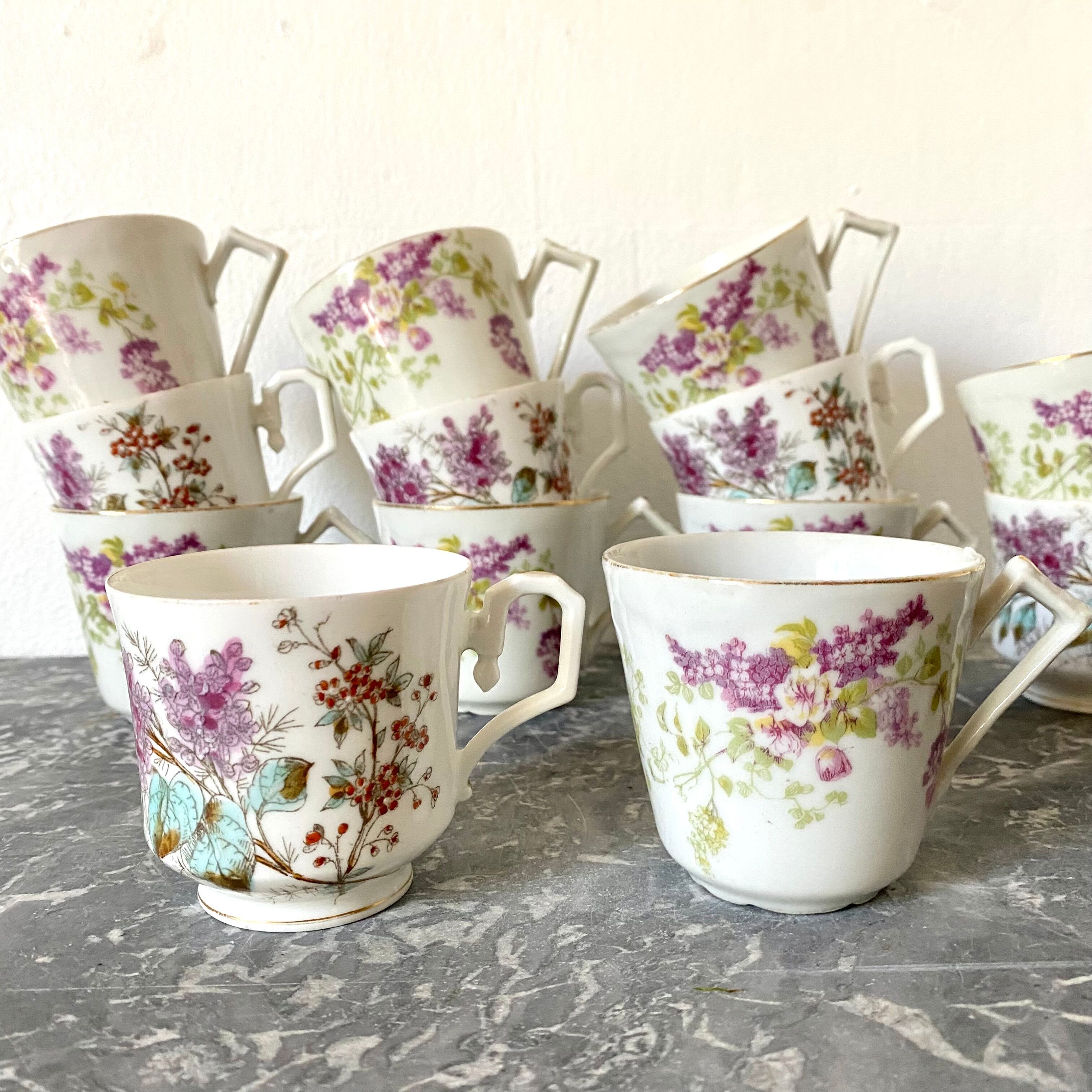 Antique flowered porcelain cups mismatched