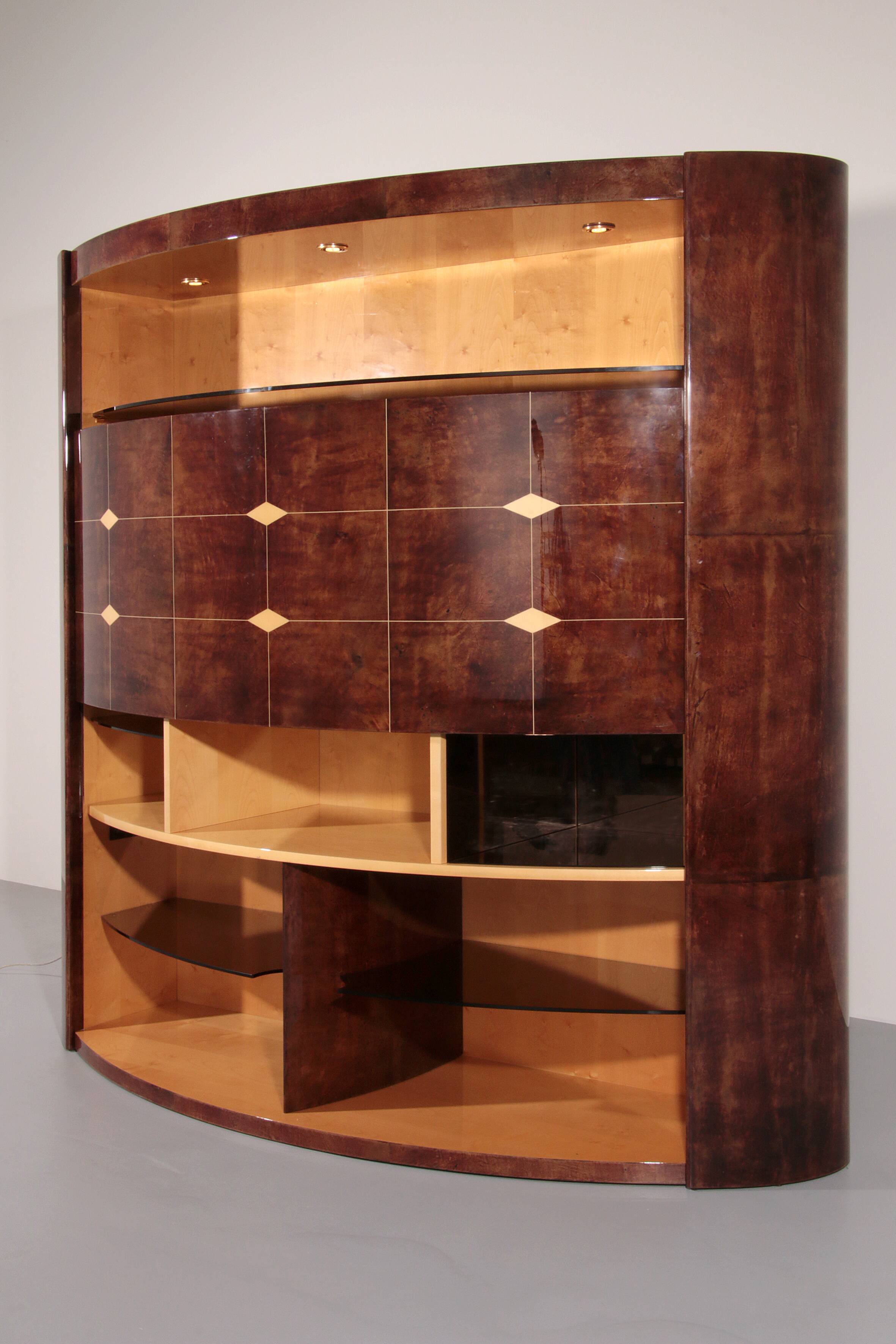 Iconic Aldo Tura brown goatskin bar cabinet with electric lift & mirror interior.