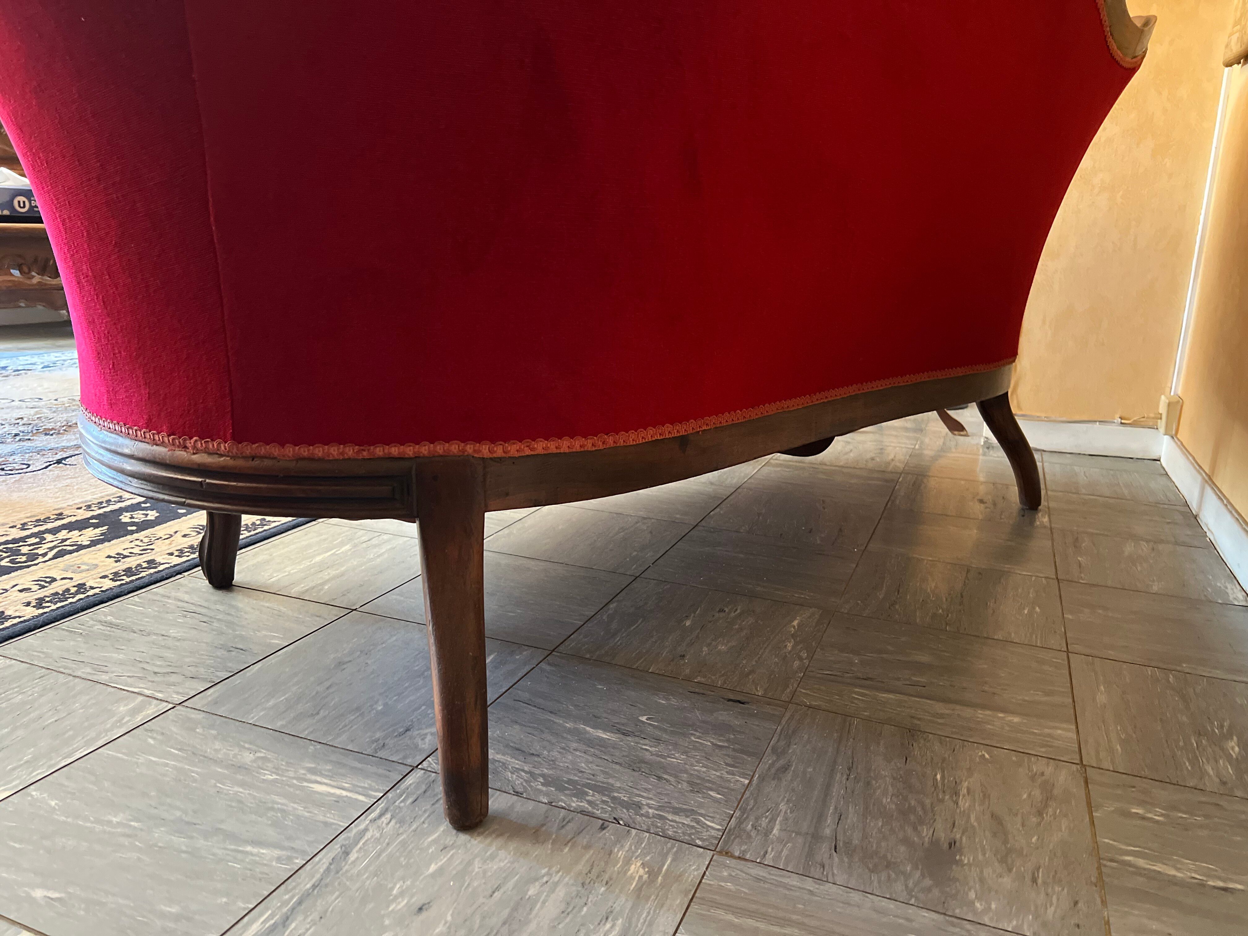 Antique canapé in wood and burgundy velvet in Louis Philippe style.