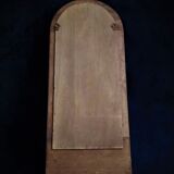 Wall mirror in arched frame with drawer
