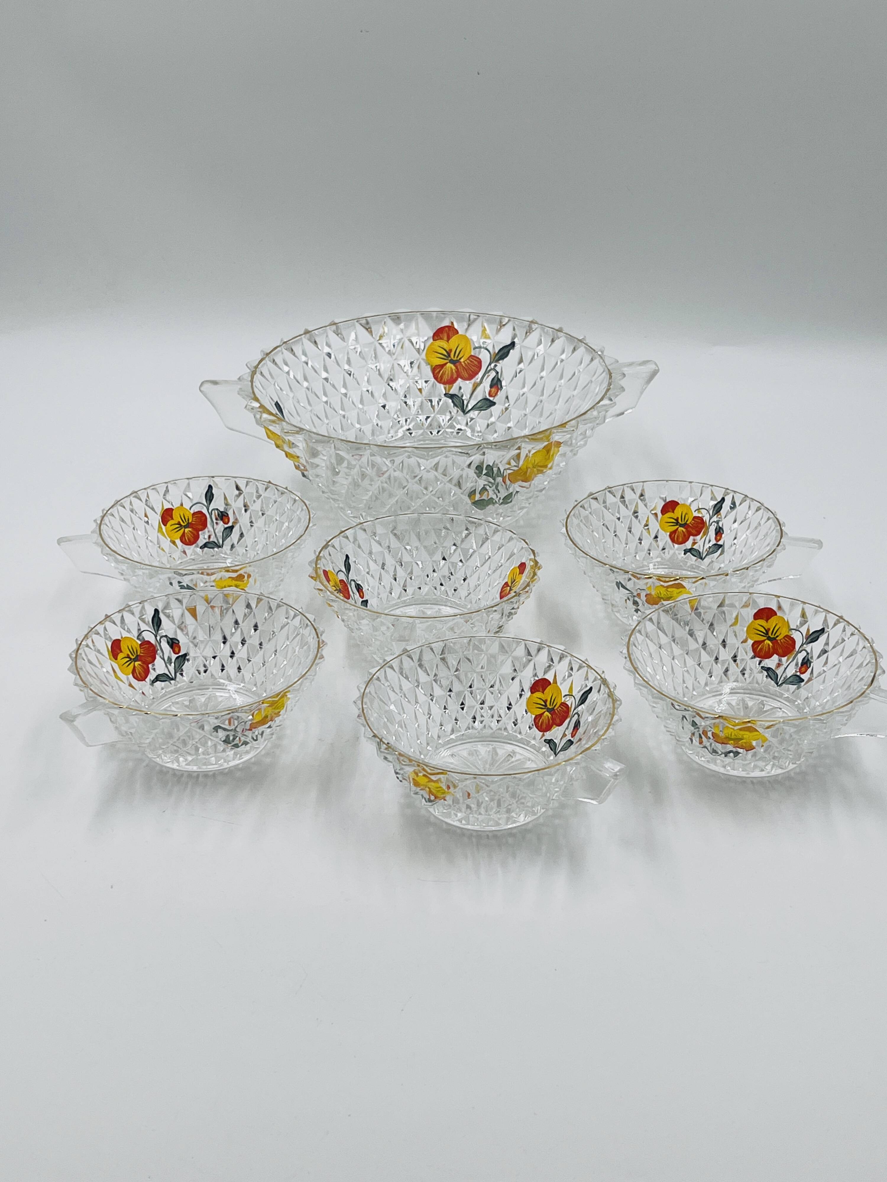 Vintage glass fruit salad serving set with a pansy design.