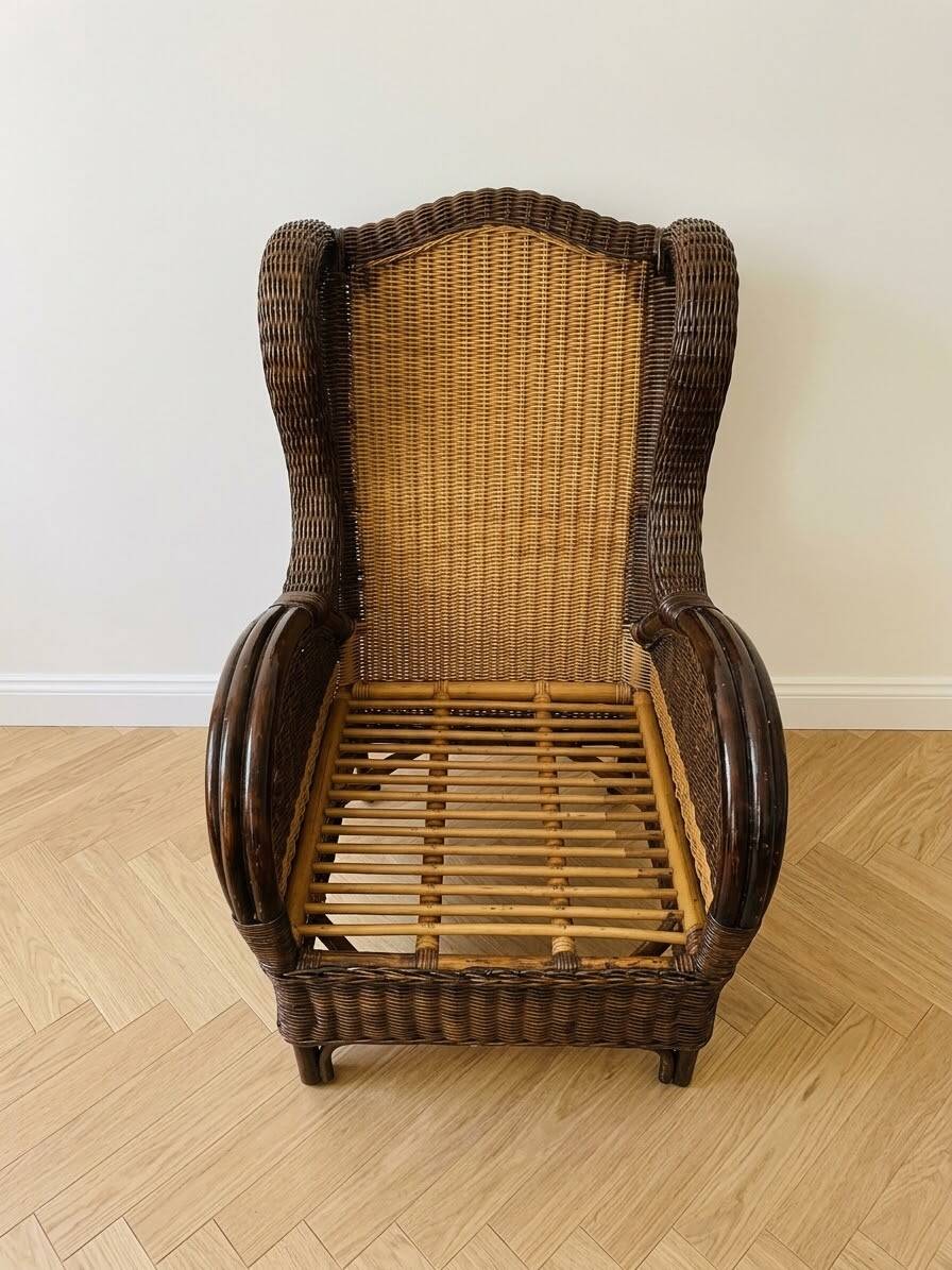 Vintage armchair in rattan and wicker with beige cushion.