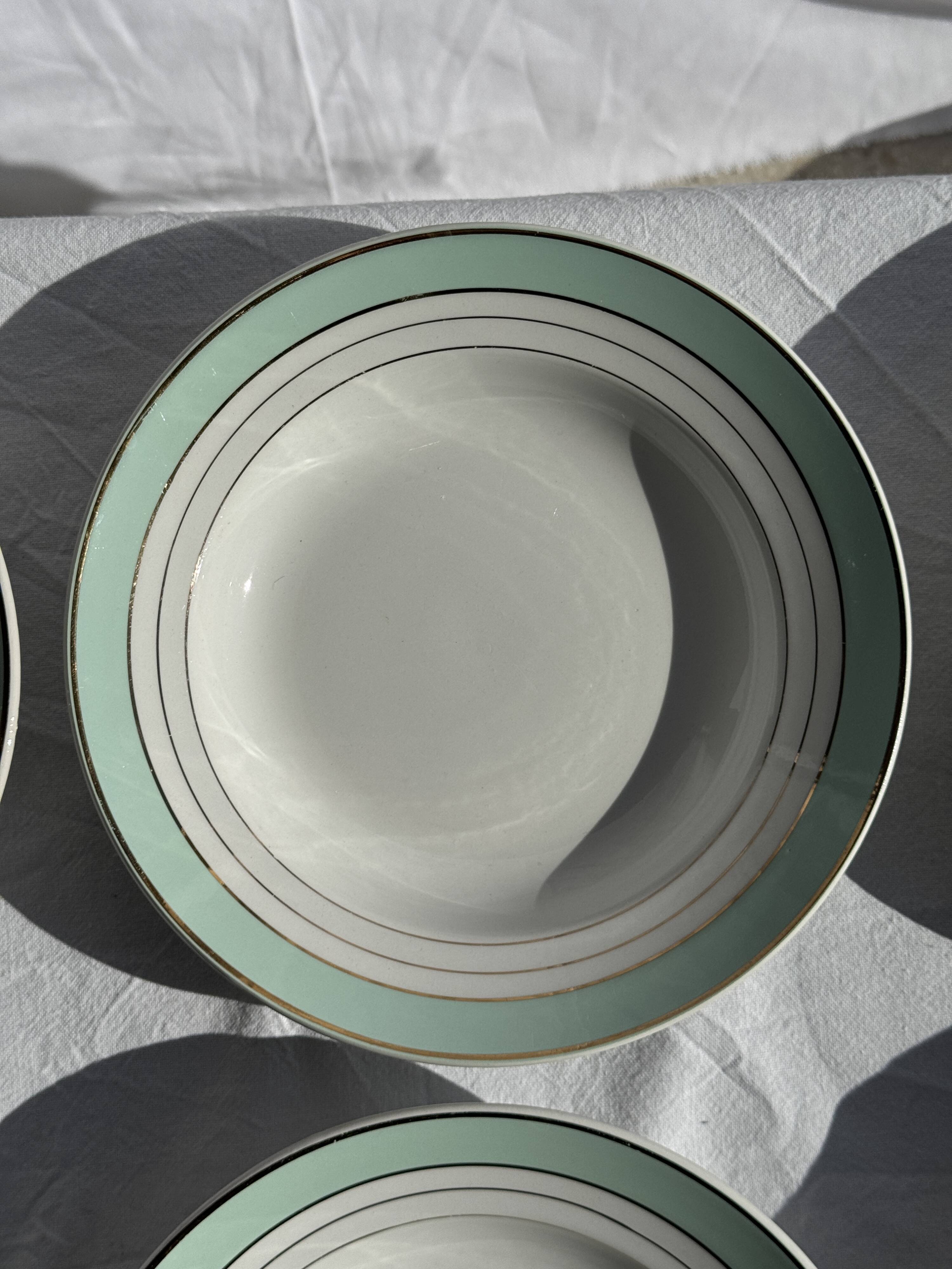 Set of 8 antique turquoise deep plates with a gold rim D22.5