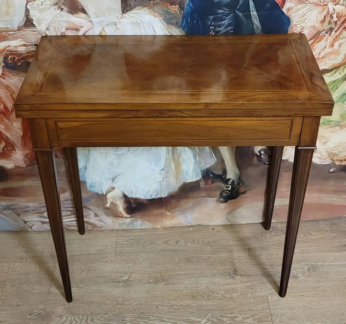 Louis XVI period game table in mahogany and marquetry.