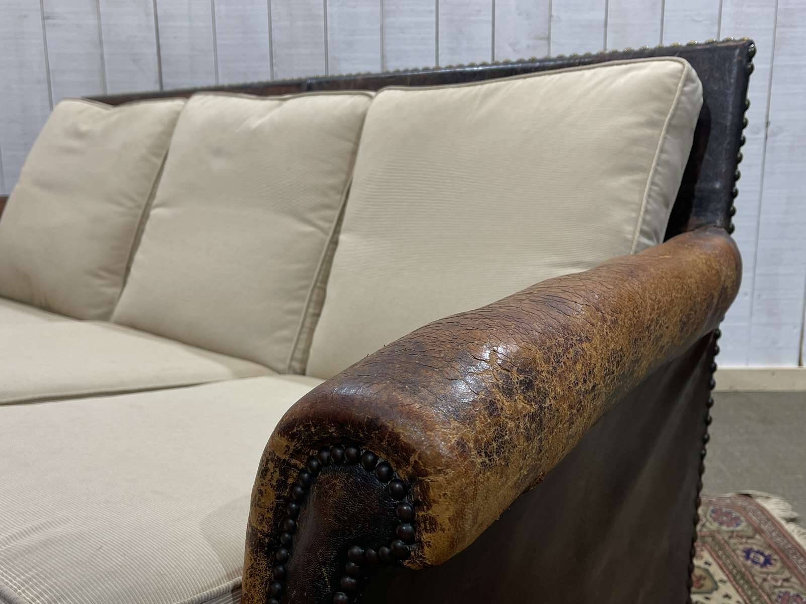 Early 20th century leather club sofa - seat and back in modern fabric