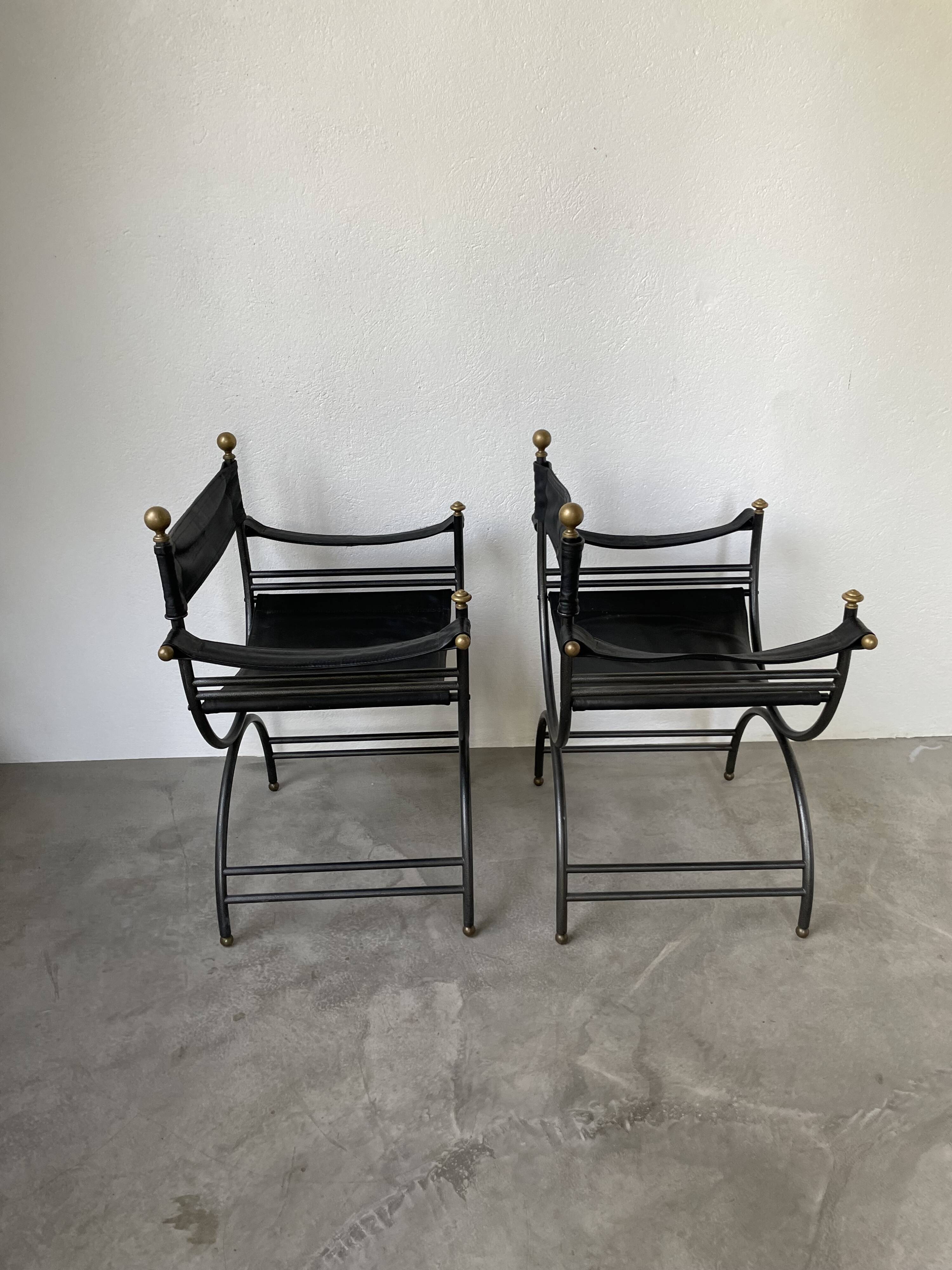 Pair of leather “curule” emperor armchairs