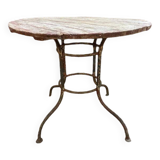 Wrought iron garden table with round top