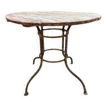 Table de jardin en fer forgé à plateau rond