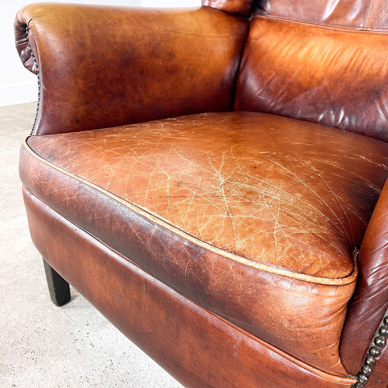 Vintage sheep leather wingback armchair Goor