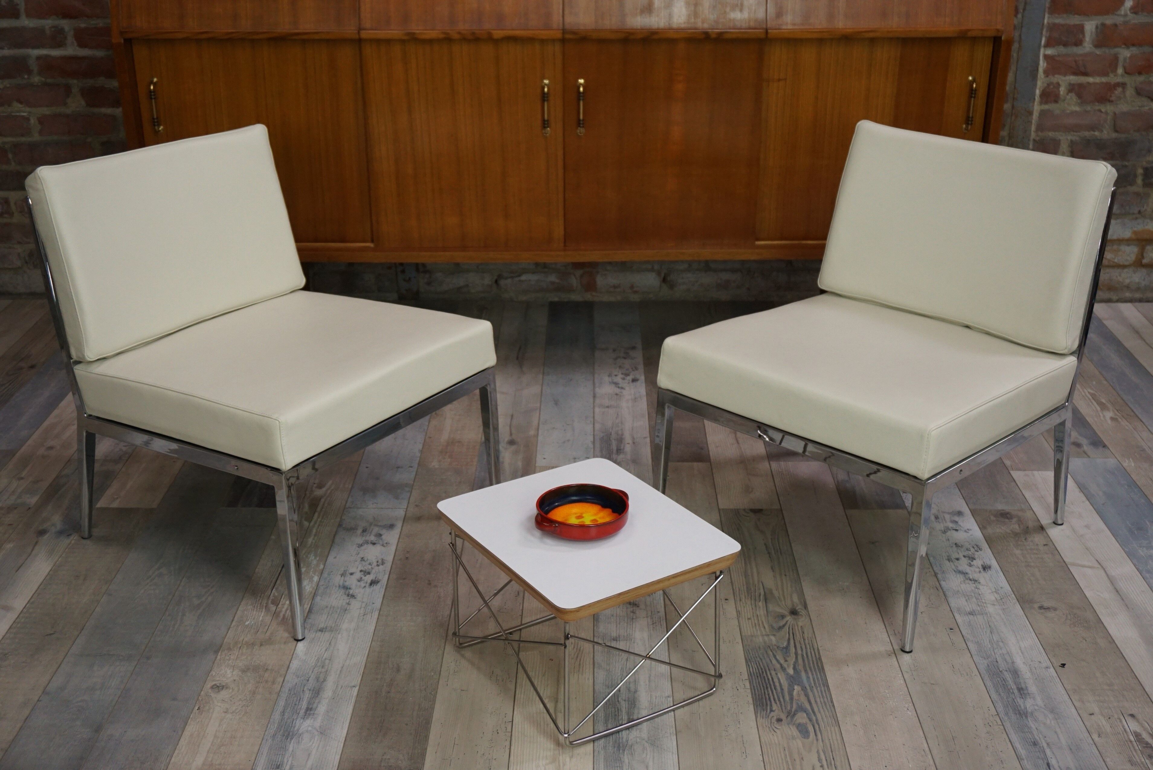 Pair of chrome and leather armchairs