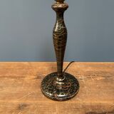 Black table lamp with paint splatters from the 1920s