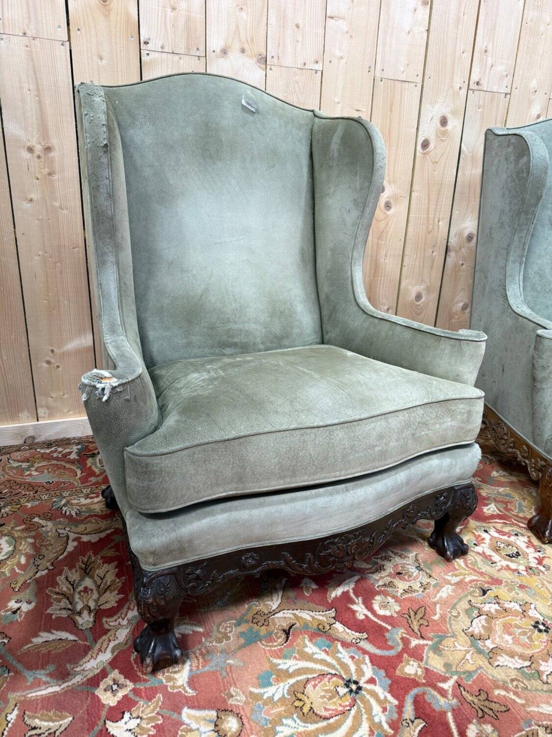 Pair of wingback armchairs in George III style – Carved wood – 18th century.