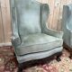 Pair of wingback armchairs in George III style – Carved wood – 18th century.