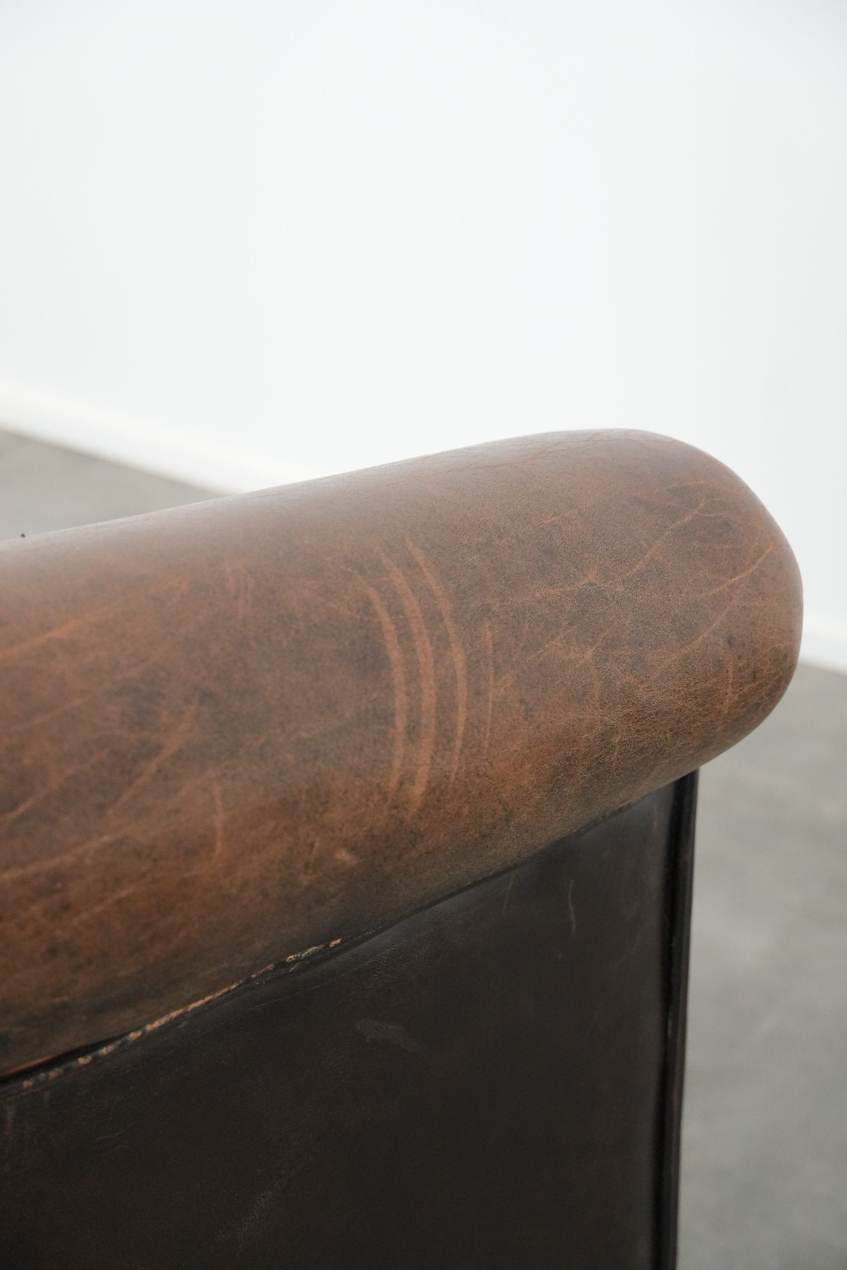 Characterful club armchair made of sheepskin with a beautiful patina