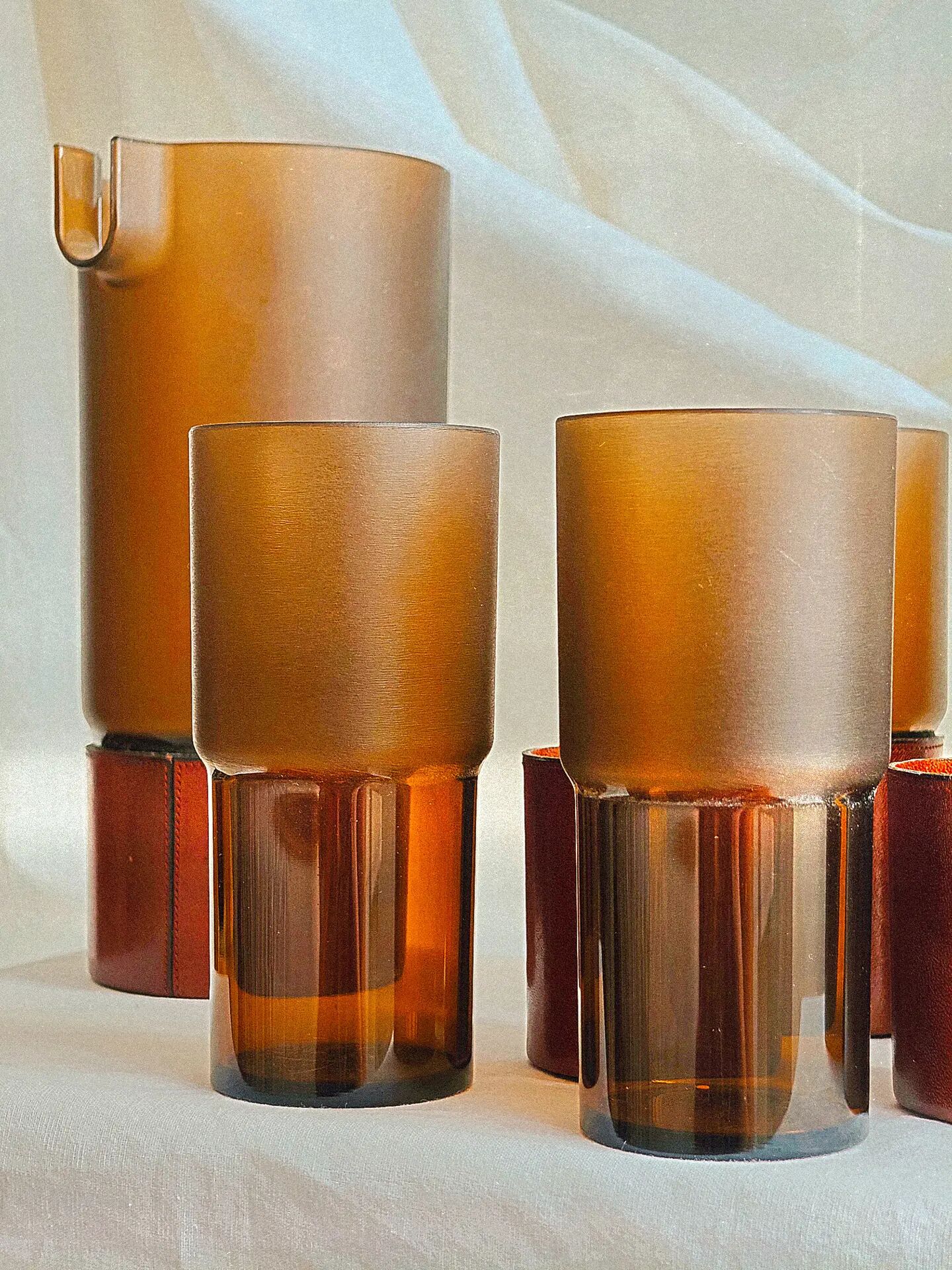 Orangeade service stamped Horstmann in stitched cognac leather.