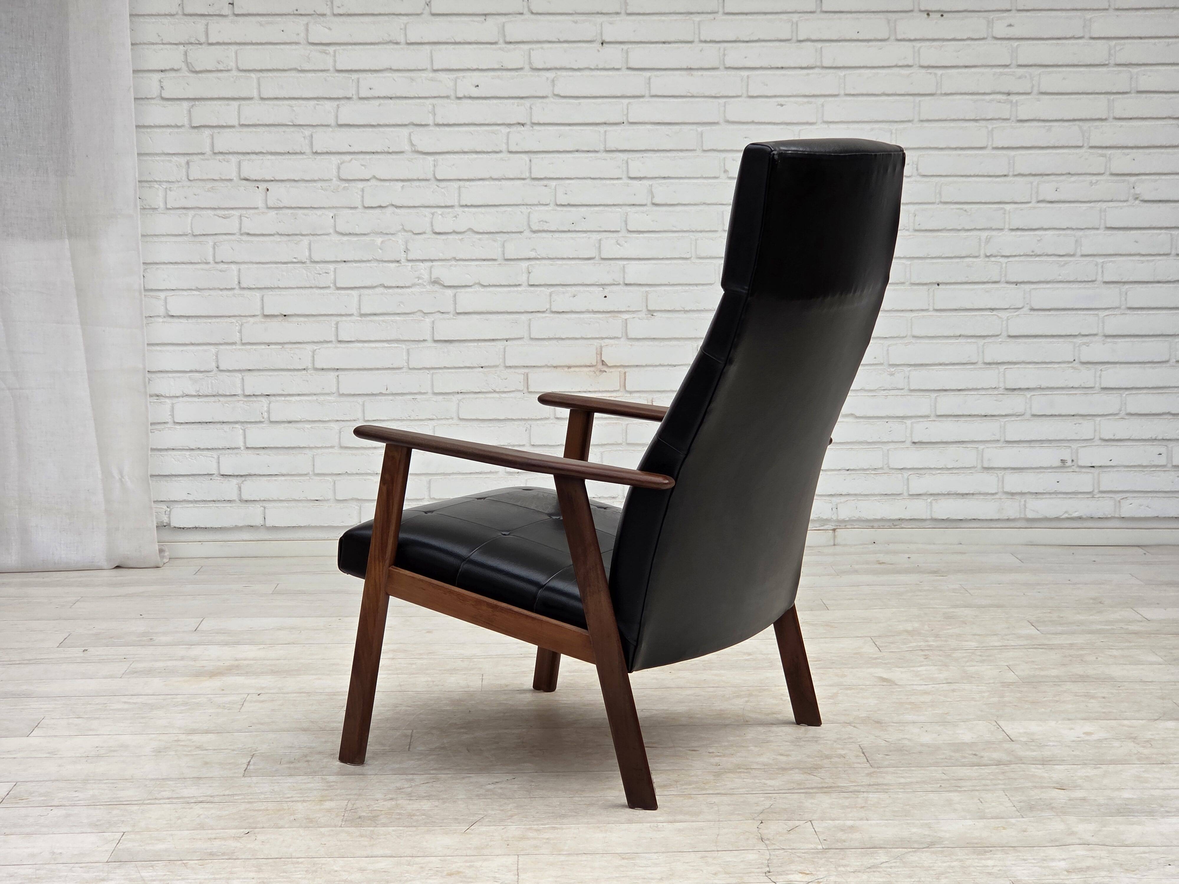 1970s, Danish armchair, black artificial leather, teak wood.