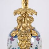 Pair of porcelain lamps decorated with bronze satyrs. Circa 1880.