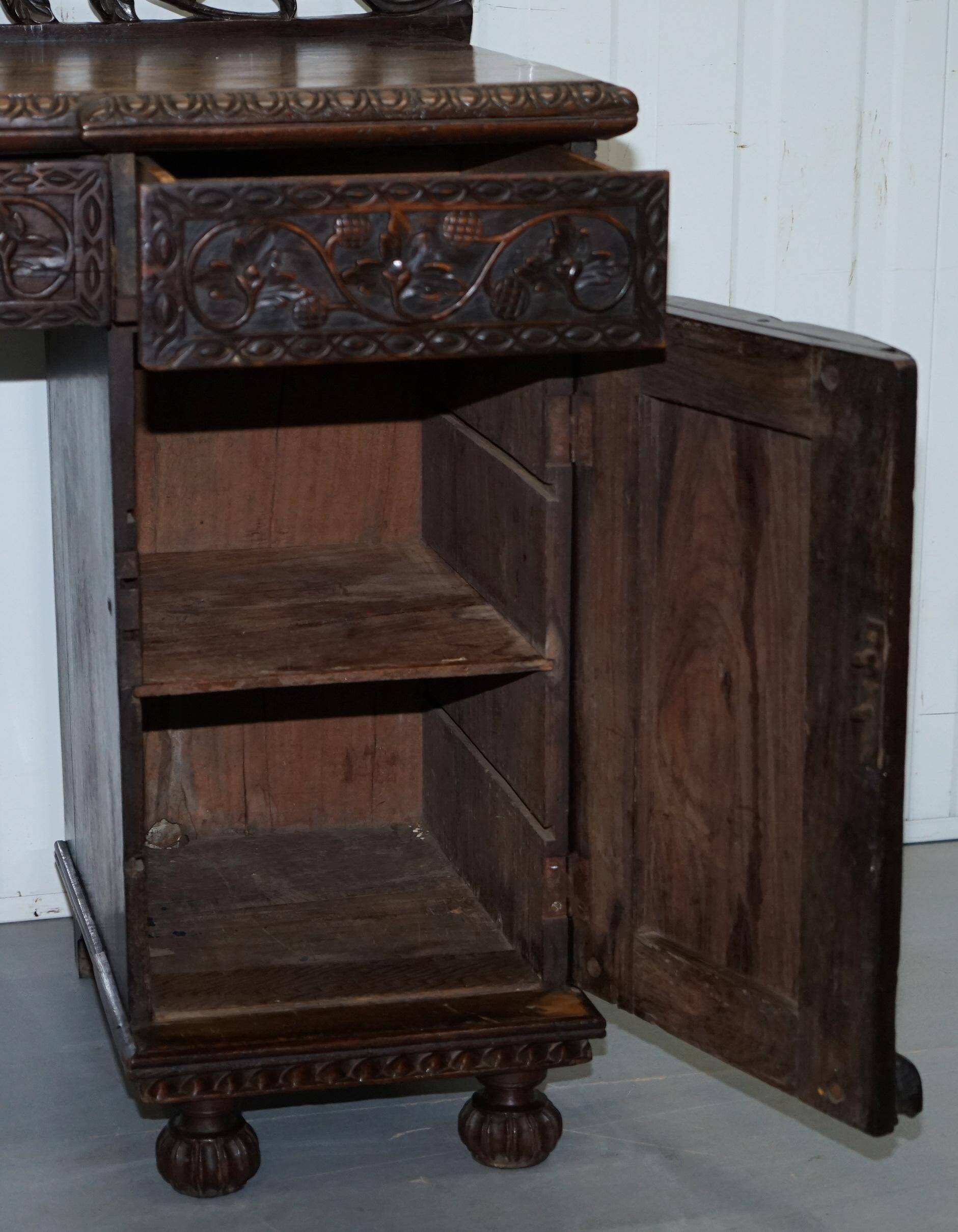 19th-century hand-carved Anglo-Burmese buffet with drawers and cupboards.