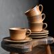 4 sandstone cups and saucers