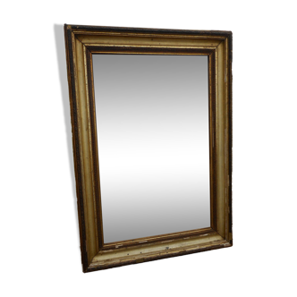 Antique mirror glass in wood and gilded stucco, late 19th century