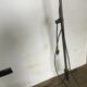 Industrial lamp on wrought iron tripod feet