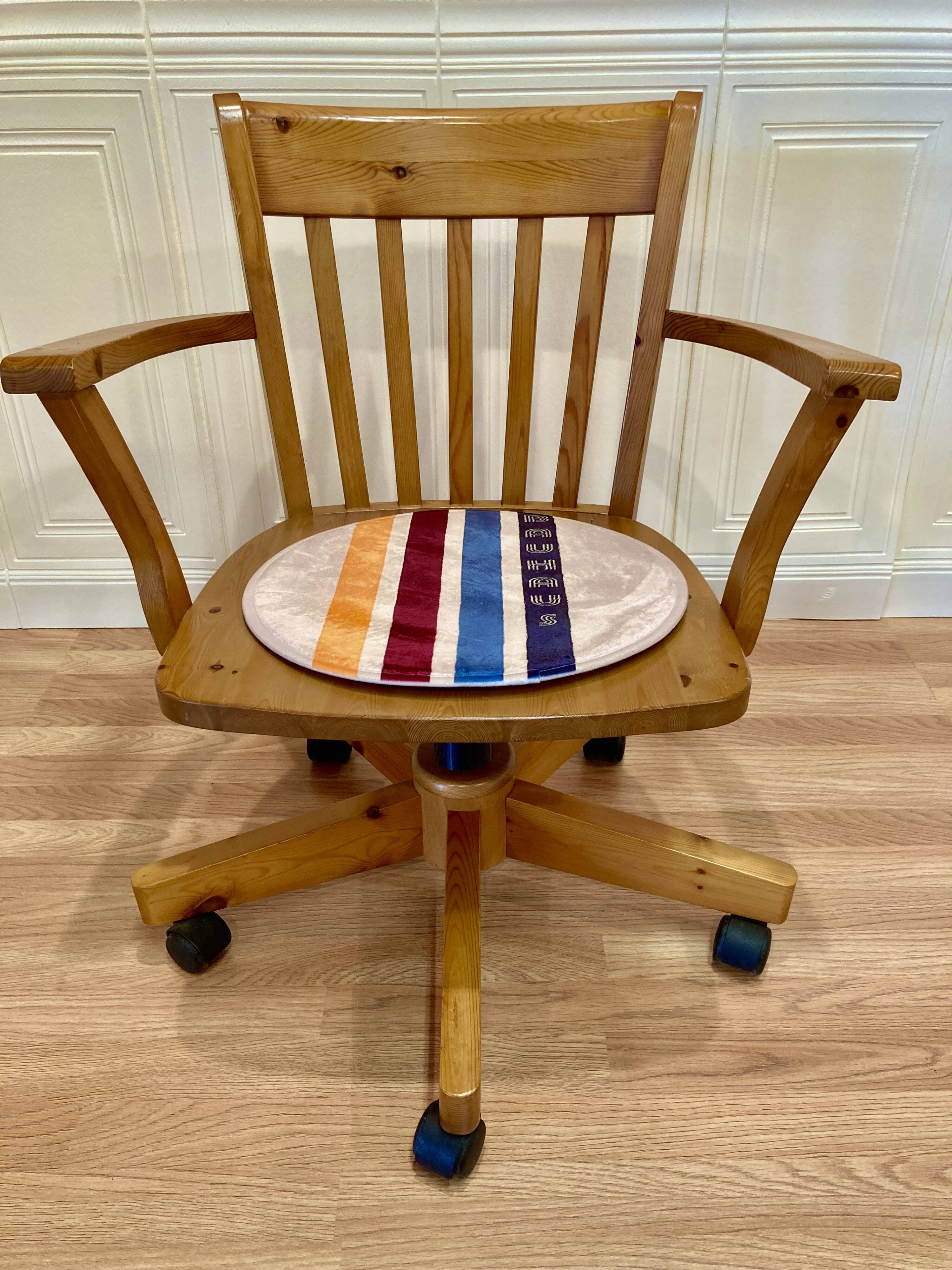Solid wood swivel and reclining armchair.