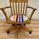 Solid wood swivel and reclining armchair.