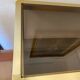 Regency style console table, in gilded metal and smoked glass