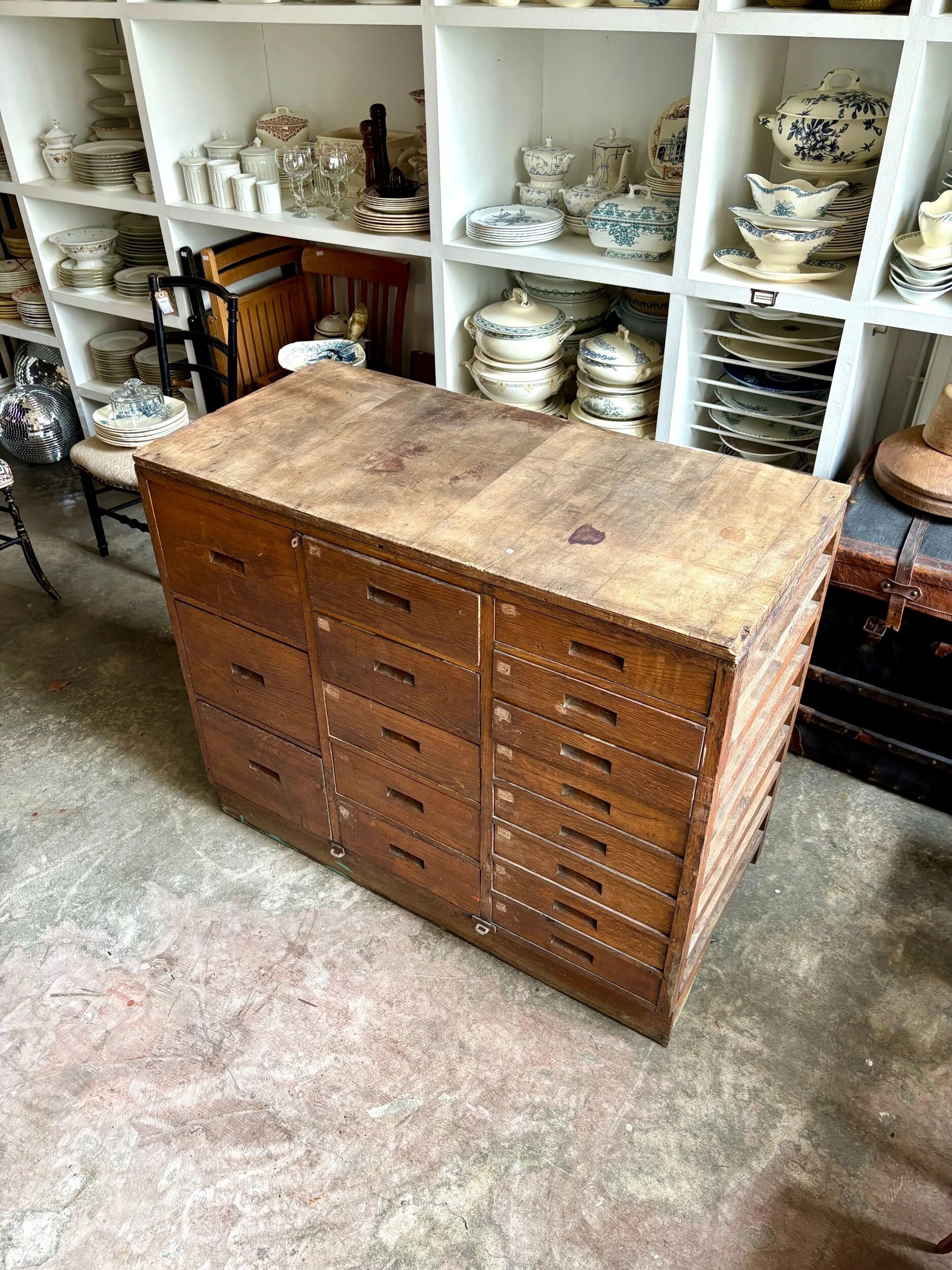 Craftsman's cabinet with 16 drawers in dark wood.