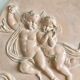 Pair of putti medallions
