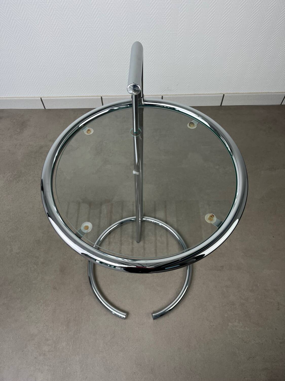 Chrome and glass design side table, adjustable.