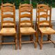 6 solid oak dining chairs with rush seats from the 1980s.