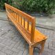 Old wooden long station bench from Belgium