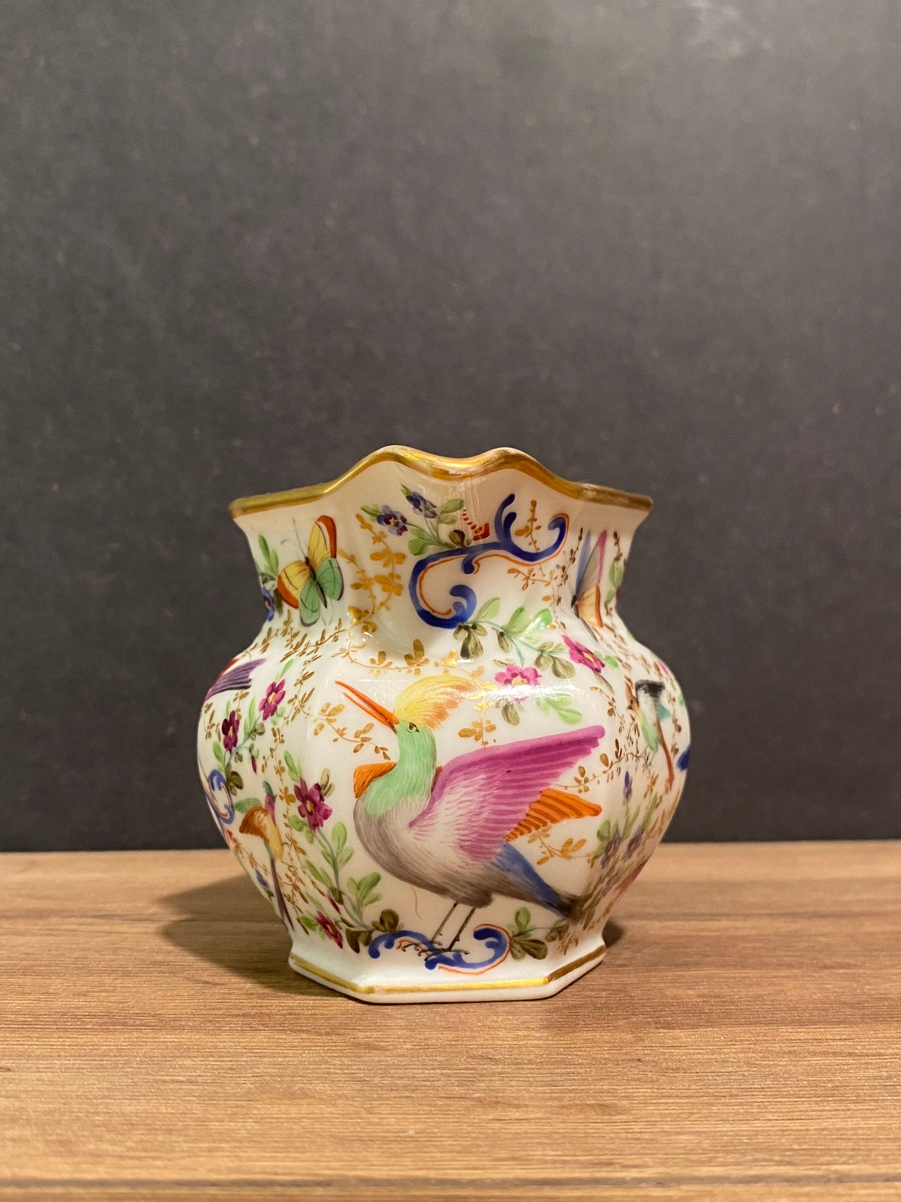 Old Paris porcelain milk jug with polychrome and gold bird floral decoration