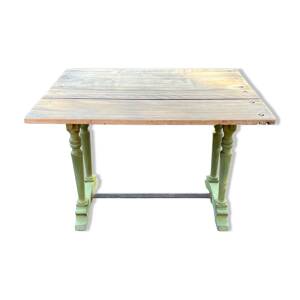 Old table with patinated green legs