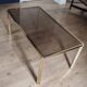 Table basse laiton plateau verre fumé