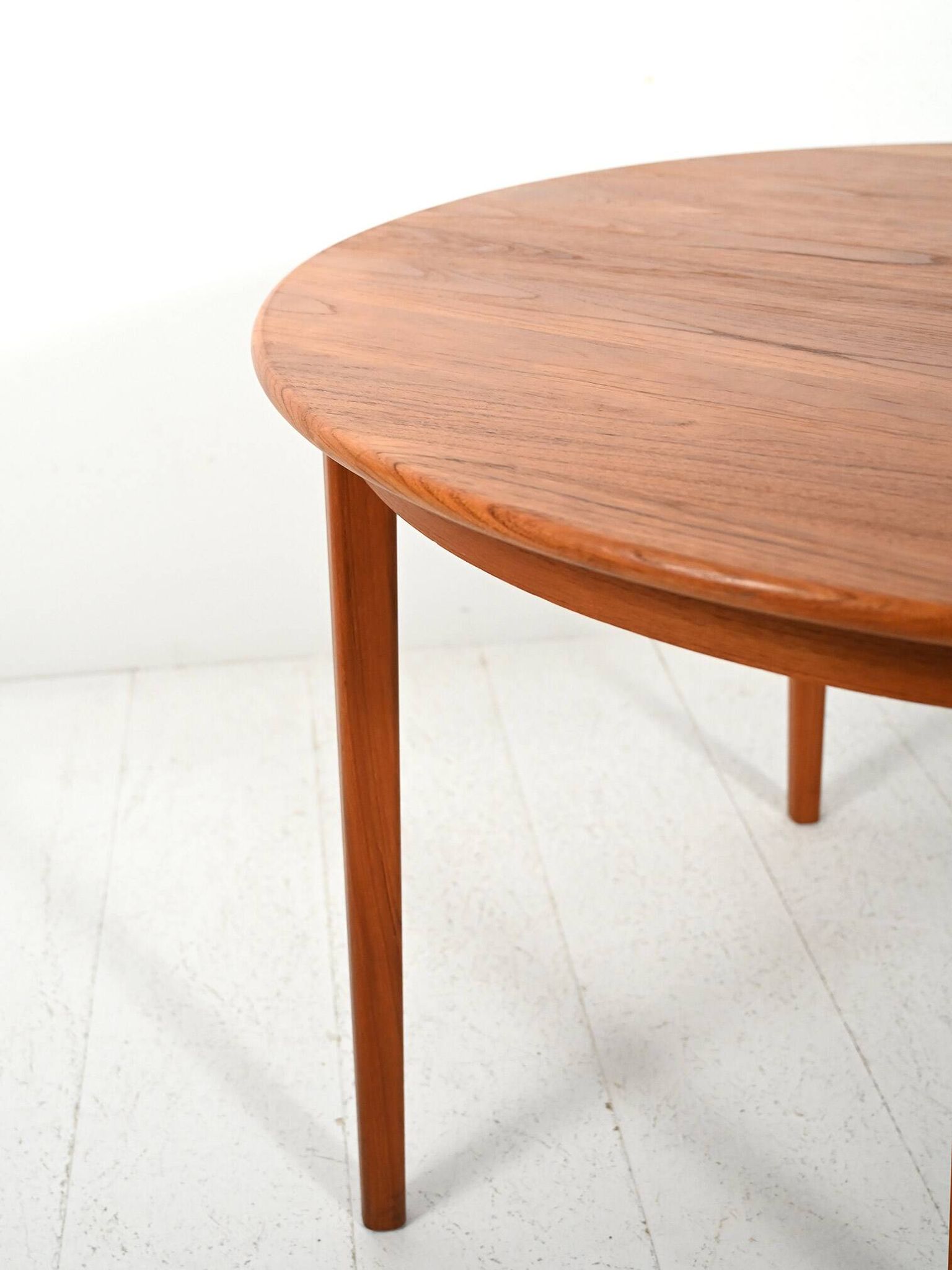 Round extendable teak table by Svante Skogh