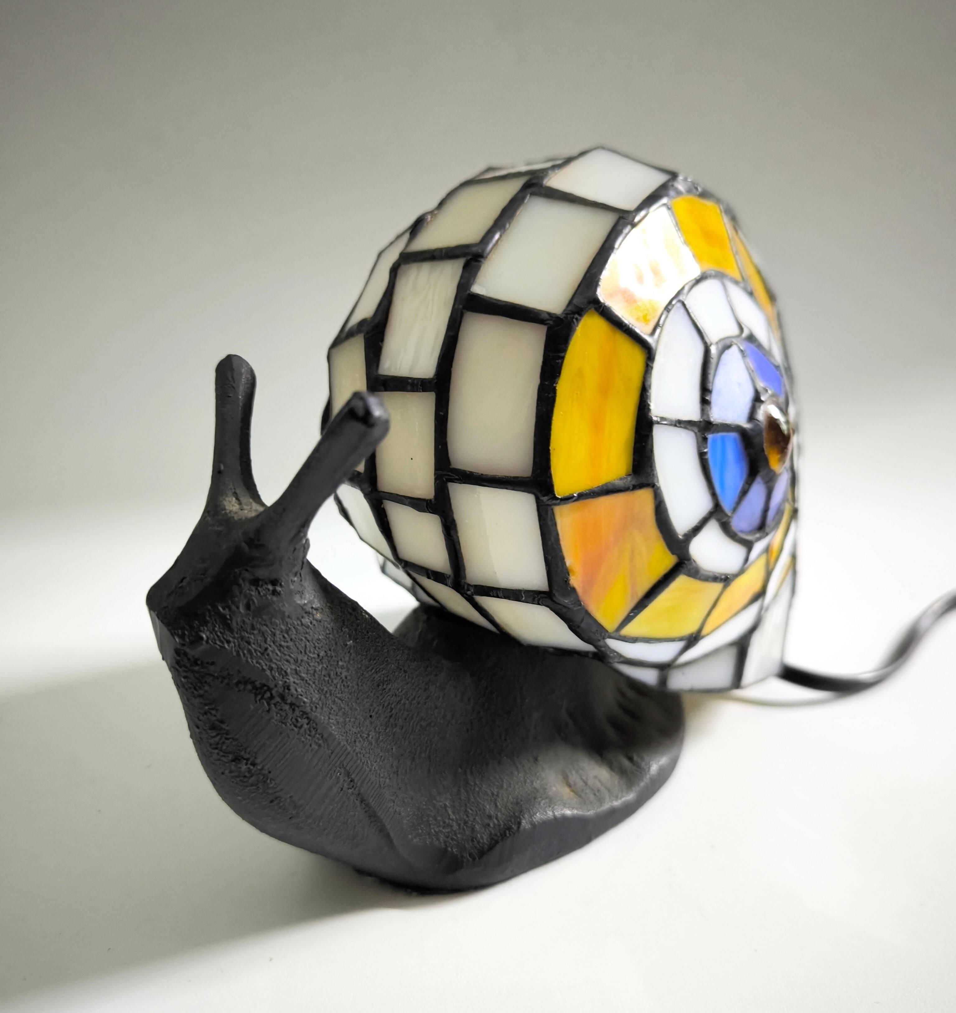 Tiffany-style lamp in the shape of a snail.
