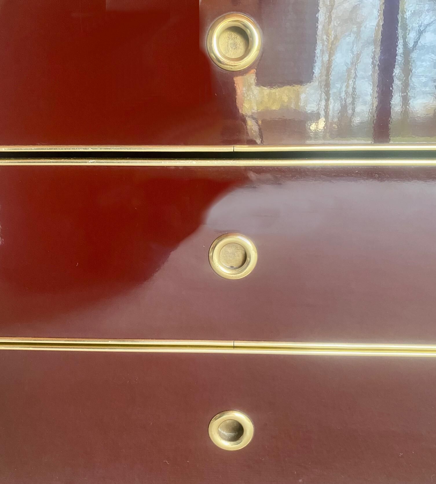 Chest of drawers and mirror in burgundy lacquer, 1980