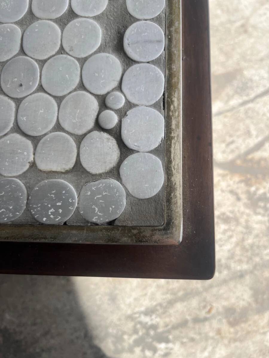 Grey ceramic mosaic top coffee table with dark wood base and brass accents, 1970s