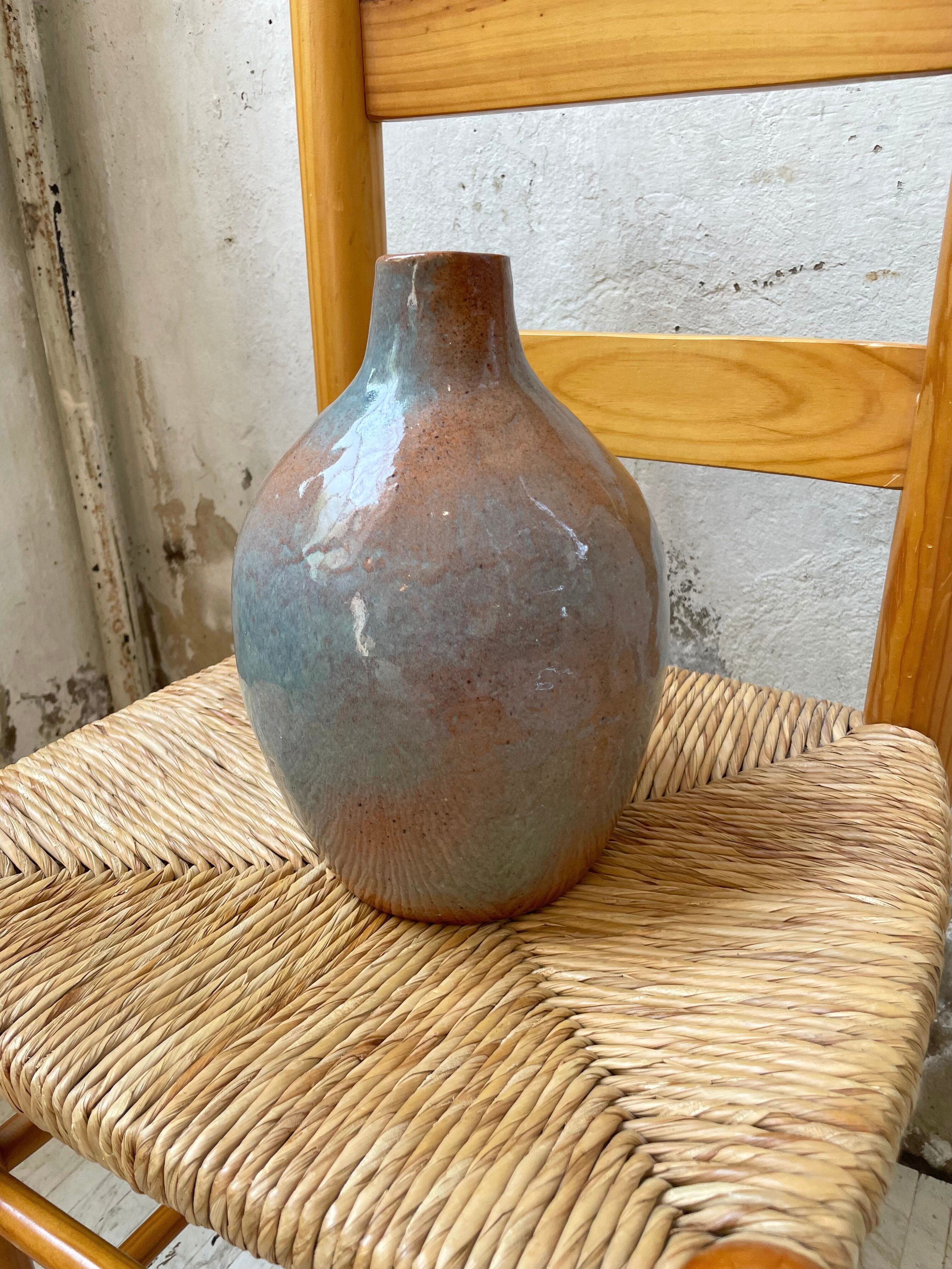 Glazed earth vase signed