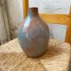 Glazed earth vase signed