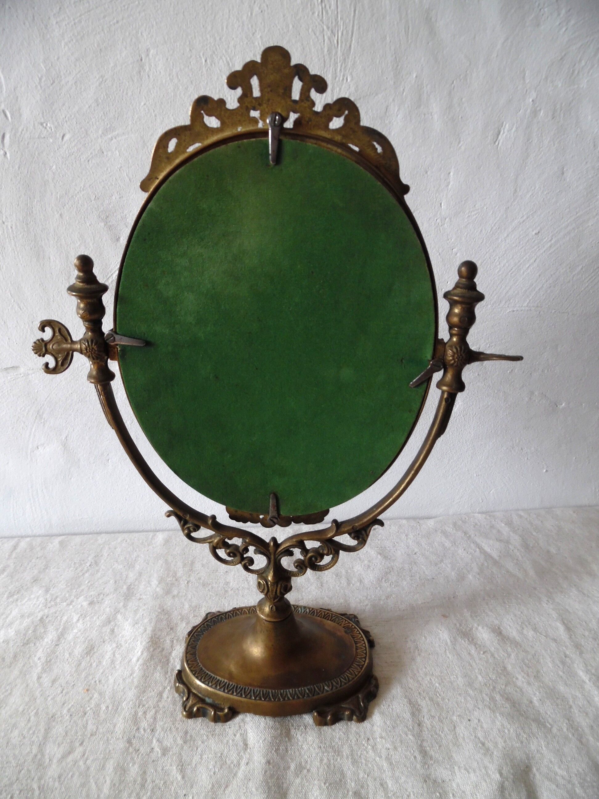 Psyche on foot brass mirror 28x39cm