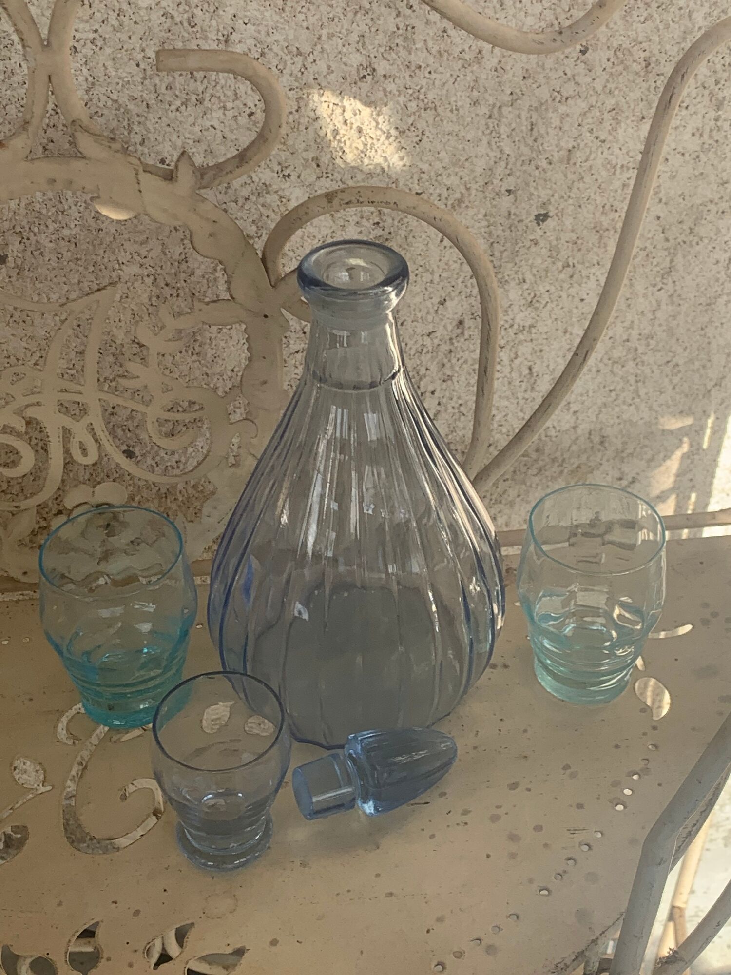 Liquor service consisting of a blue glass decanter and. 3 small antique glasses