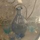 Liquor service consisting of a blue glass decanter and. 3 small antique glasses