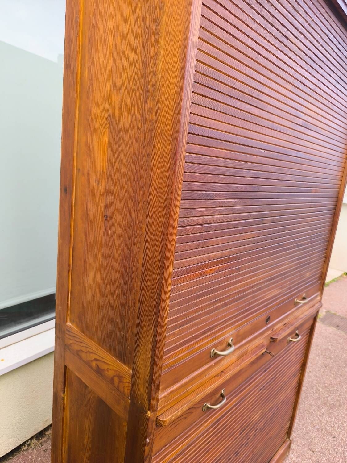 Vintage 1940s secretary desk with wooden curtains, storage, and shutters.